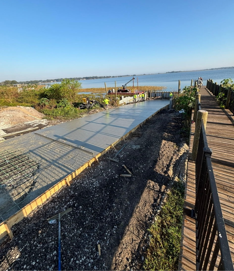 Community boat ramp with sheet pile seawall, night concrete pour and finished timber boardwalk