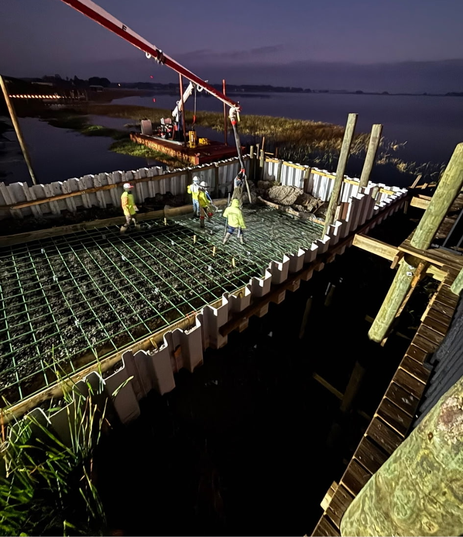 Rebar and forms on top of a sheet pile wall before the concrete pour